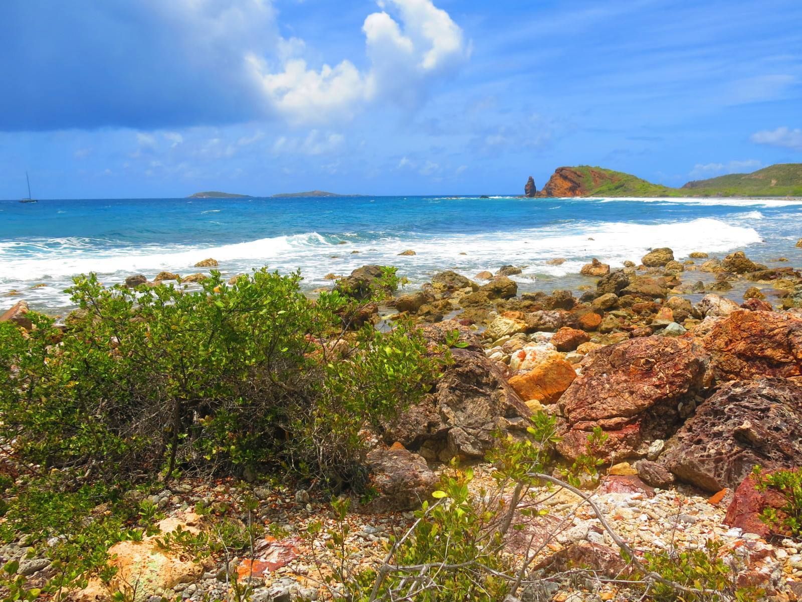 A view of the ocean from a rocky shoreline