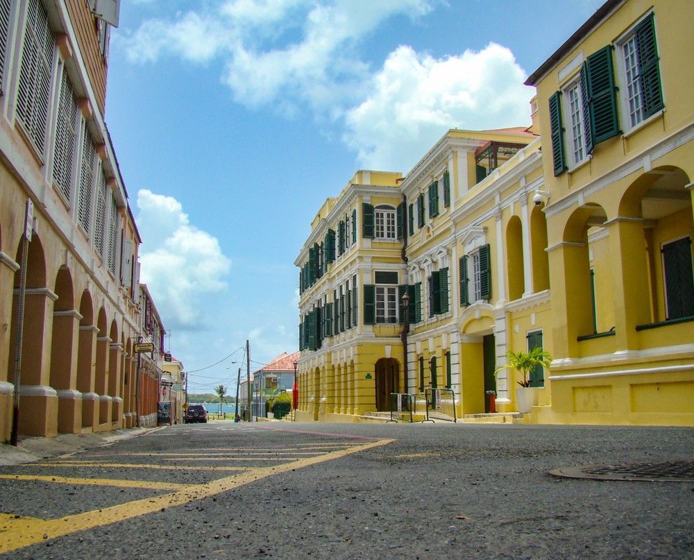 A street with a lot of yellow buildings on it