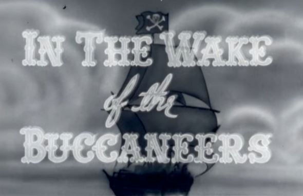 A black and white photo of a ship with the words in the wake of the buccaneers