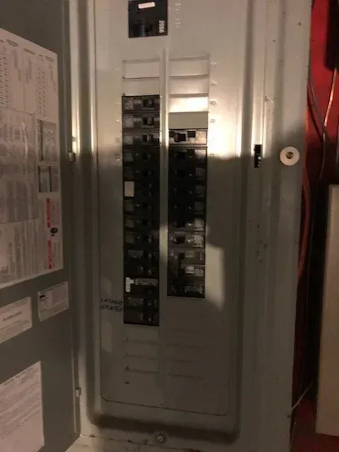 A close up of a electrical panel in a room.