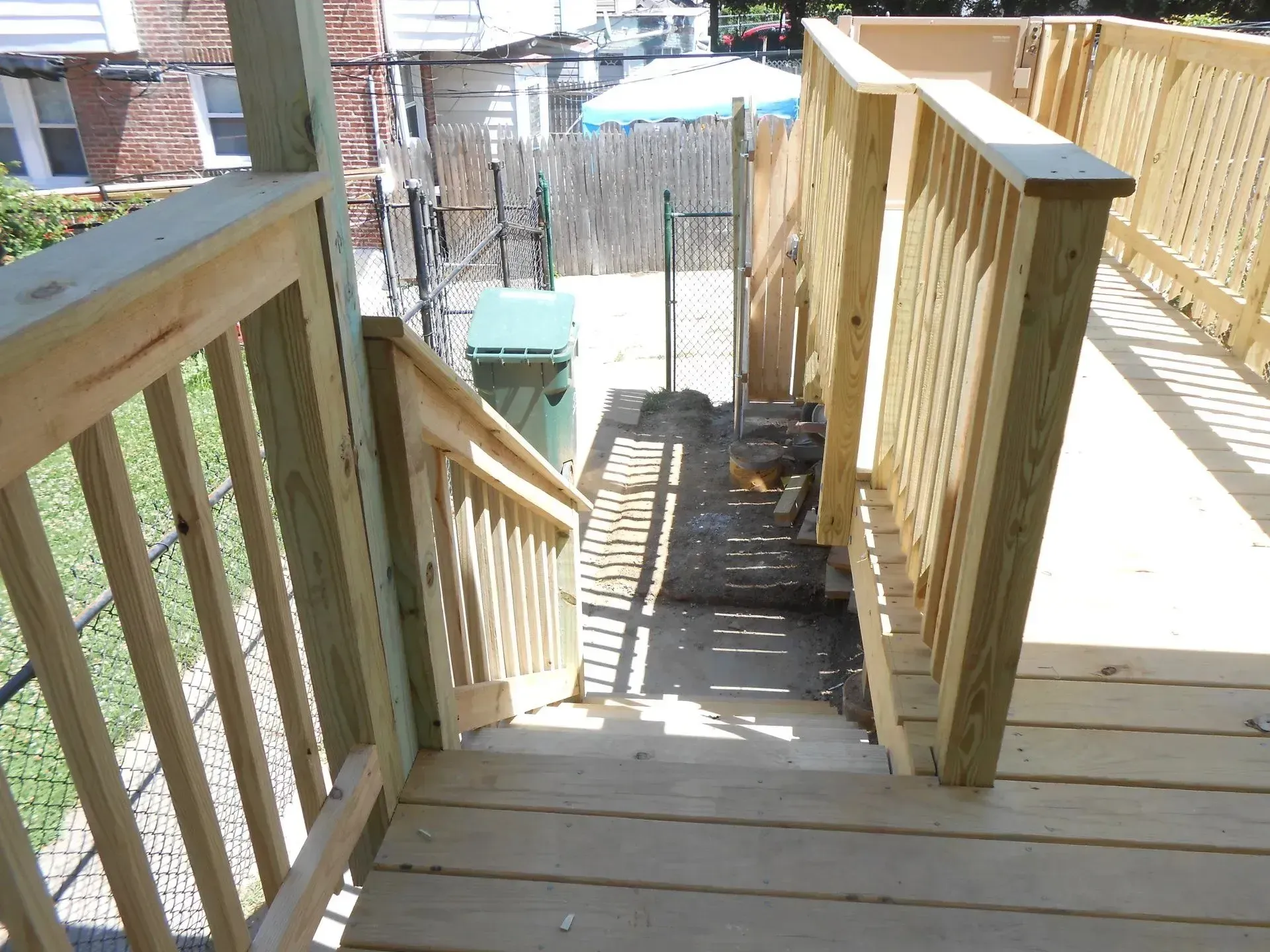 A wooden deck with stairs leading up to it