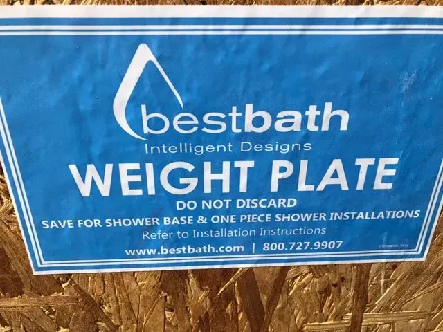 A sign that says bestbath intelligent designs weight plate