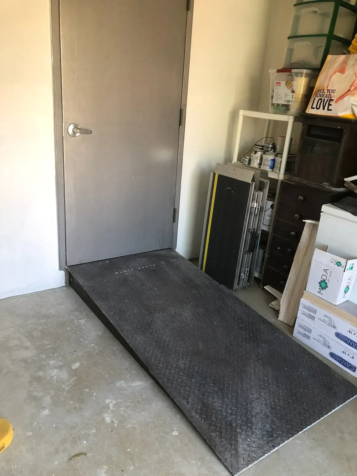 A room with a door and a ramp in it.