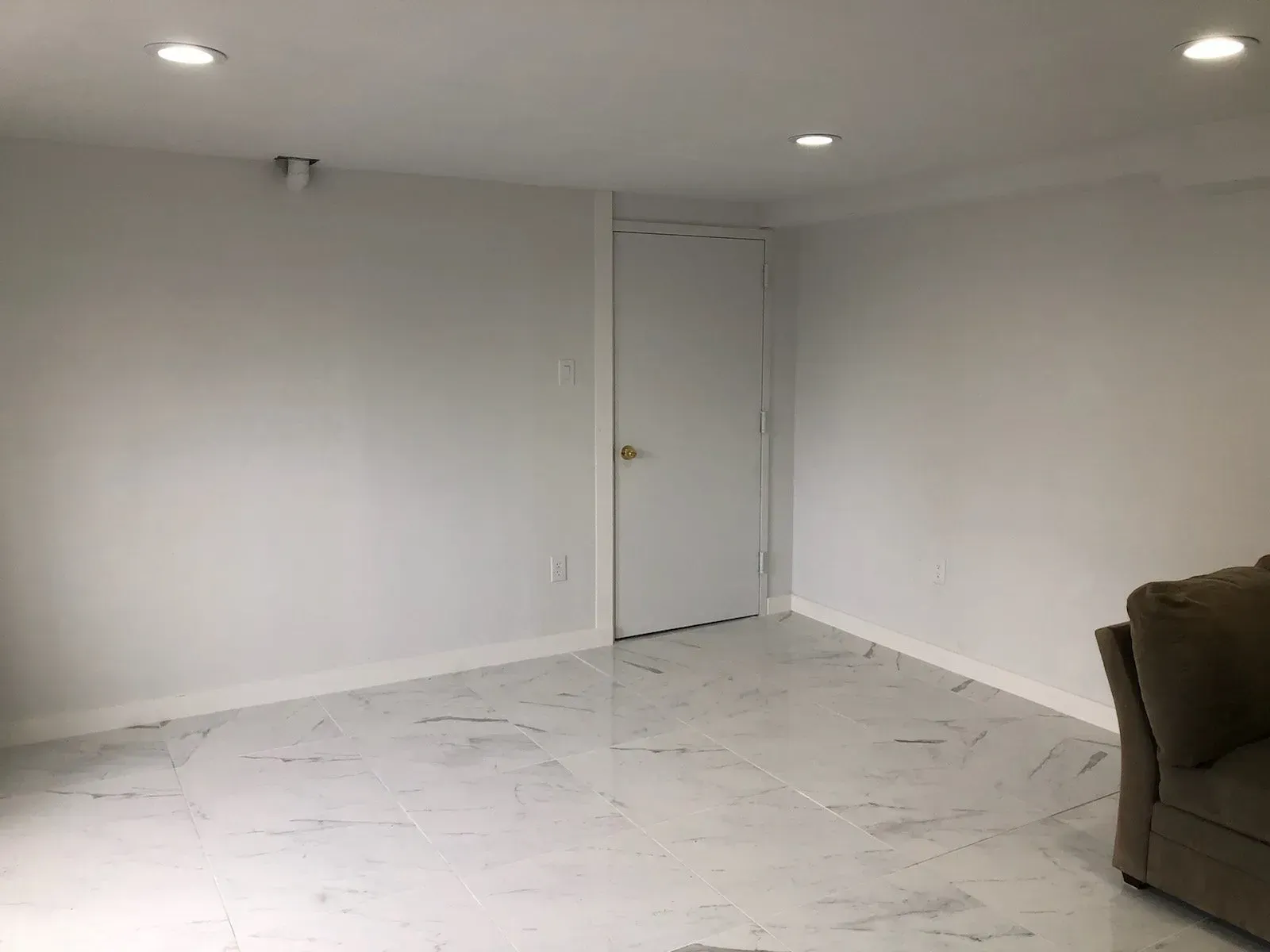 There is a couch in the middle of the room.