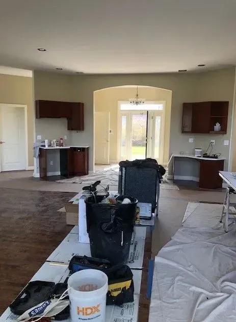 There is a cup of coffee on the table in the middle of the room.