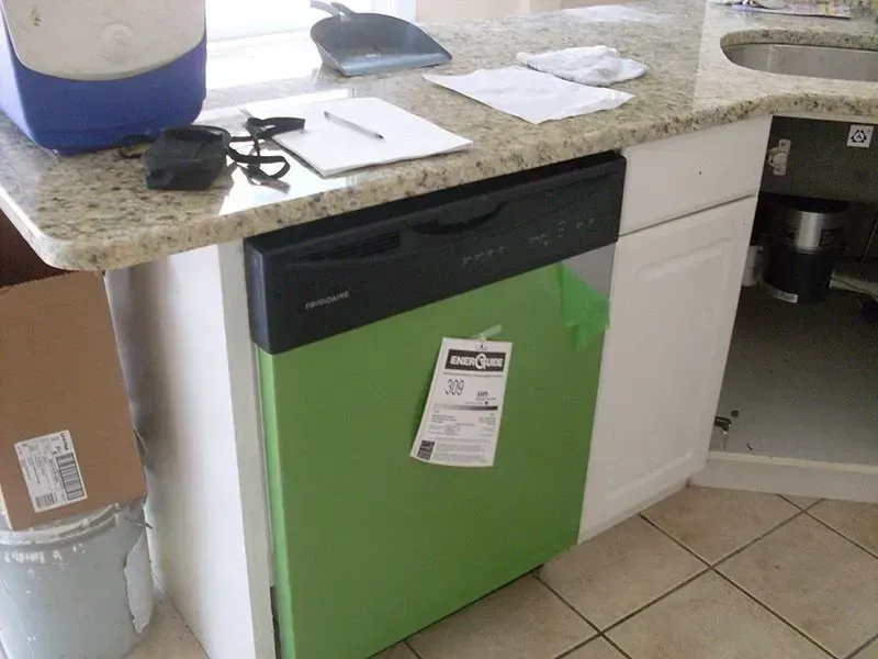 A green dishwasher with a label that says 15 on it