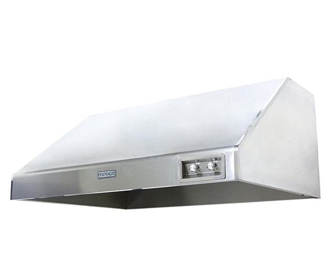 A stainless steel hood is hanging on a white wall.