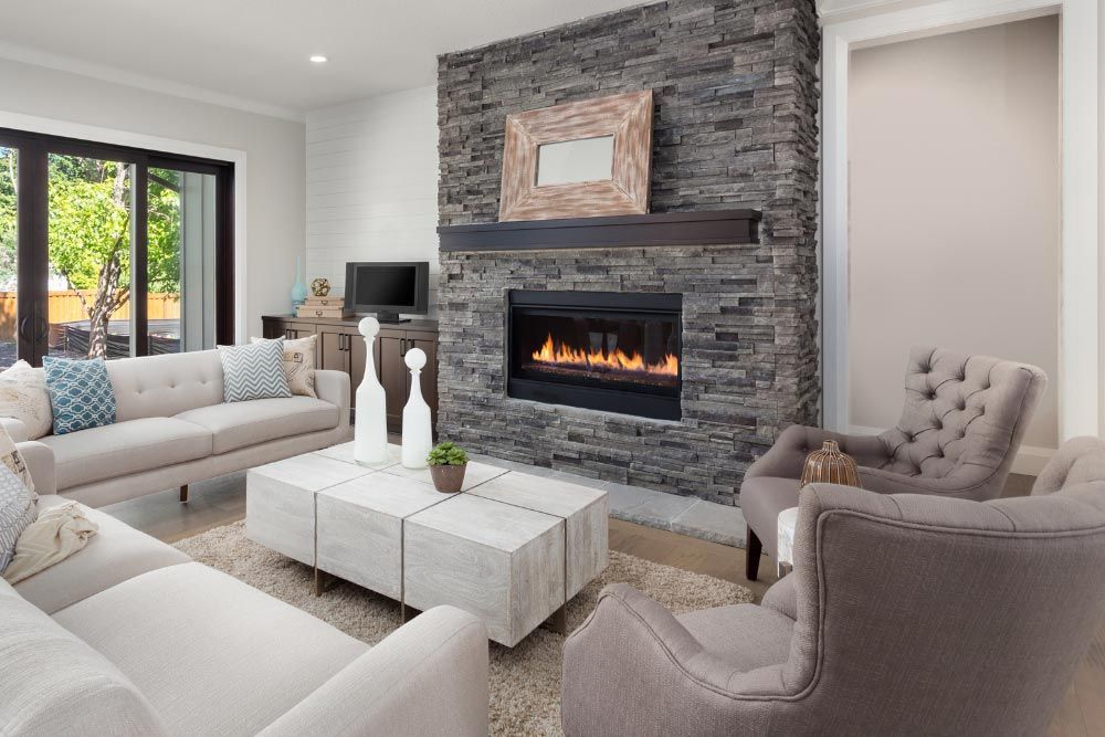 fireplace and chairs around
