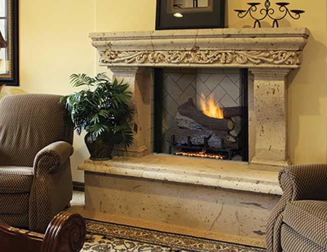 A living room with a fireplace and two chairs