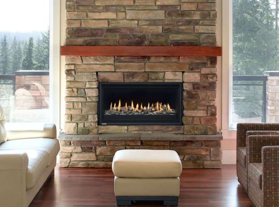 A living room with a fireplace and a couch