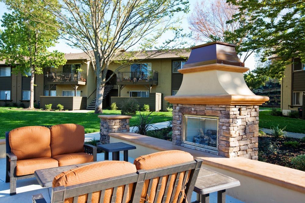 outdoor fireplace and chairs
