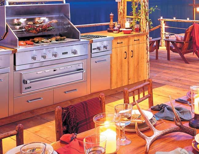 A kitchen with a grill and a table with candles on it