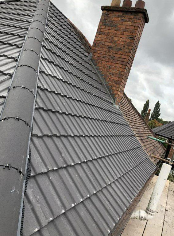 picture of a new roof semi detached roof in grey concrete tile