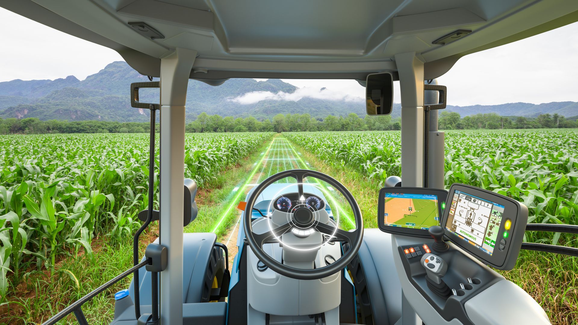 The inside of a tractor is shown with a field in the background.