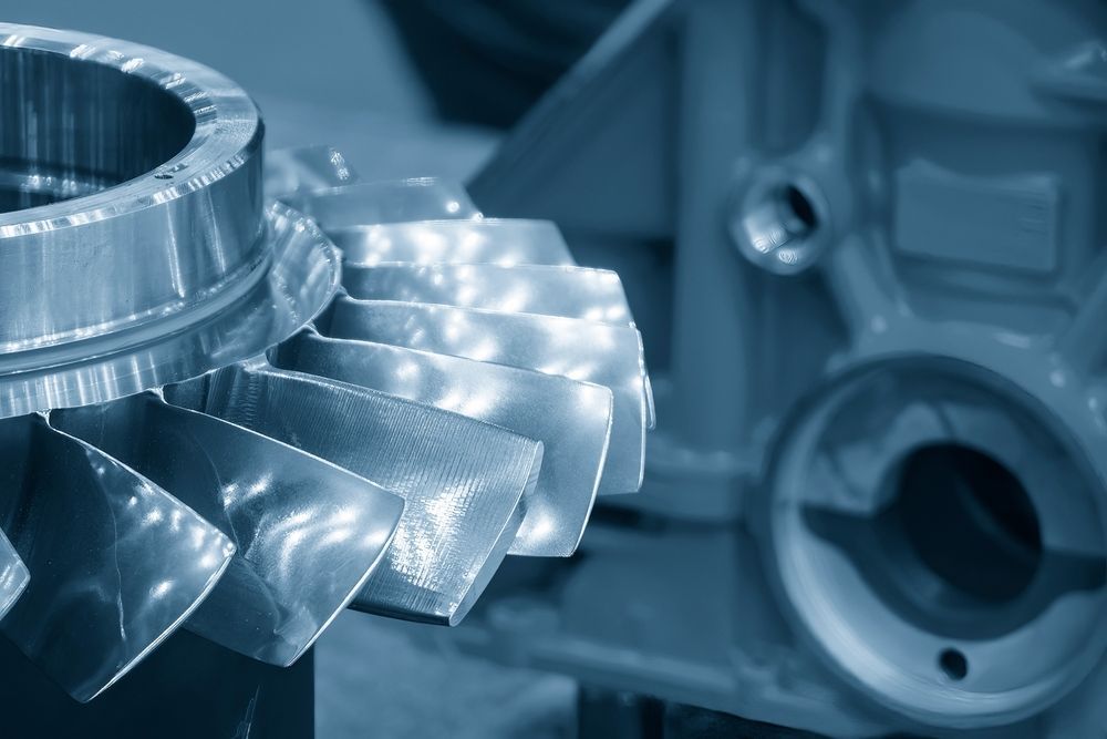 A close up of a metal gear in a factory