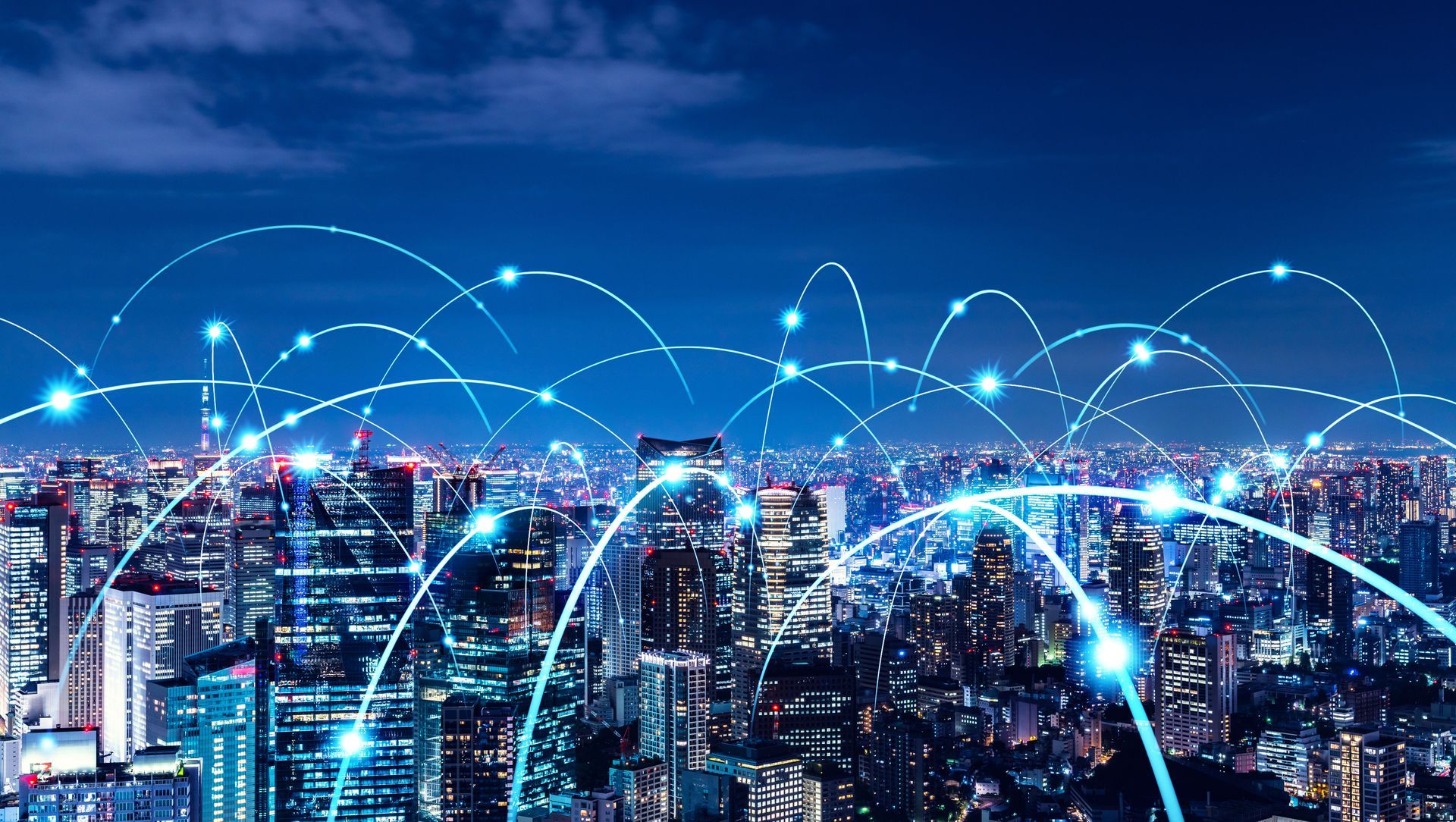 An aerial view of a city at night with a lot of lines connected to each other.
