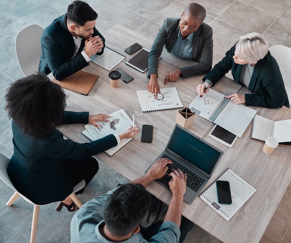 Person using computer with a virtual display showing green initiatives and a CO2 symbol.