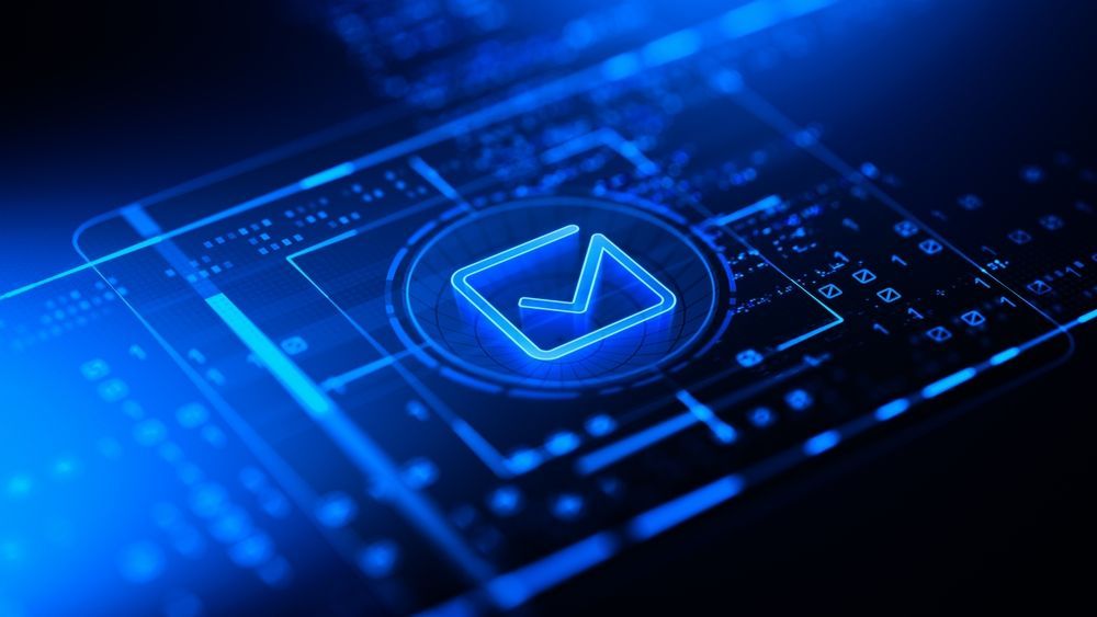 A blue envelope icon is glowing on a computer screen.