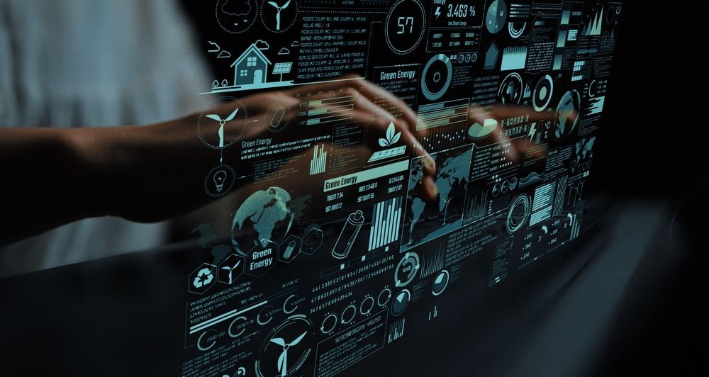 Person's hands interacting with a holographic display showing sustainability and electronics.
