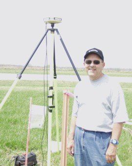 A man standing in front of optical level — Prospect, OH — Fox Surveying Company