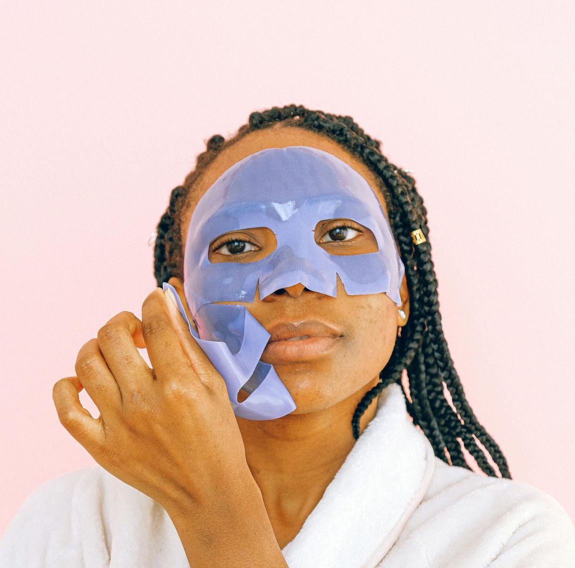 A woman wearing a purple mask on her face