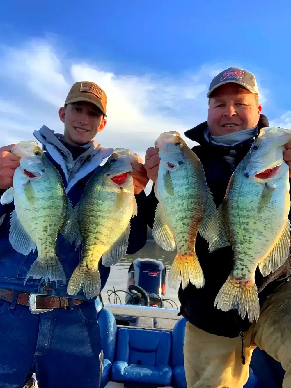Fishing Charter Rates Keeping It Crappie Guide Service Fishing Charter in Lake Dardanelle Arkansas Two men are holding fish in their hands on a boat.