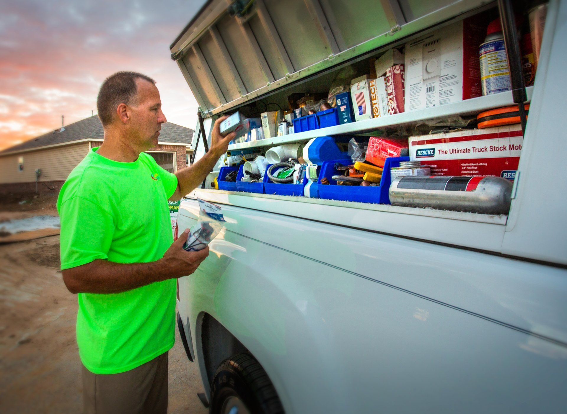 man standing by truck