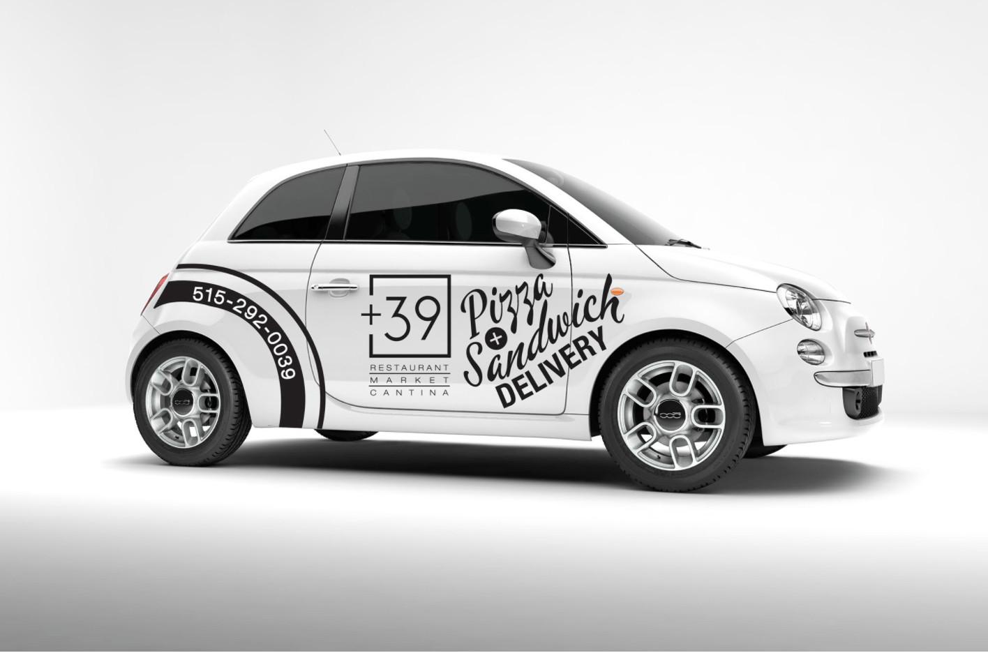 A white car with the words pizza sandwich delivery on it