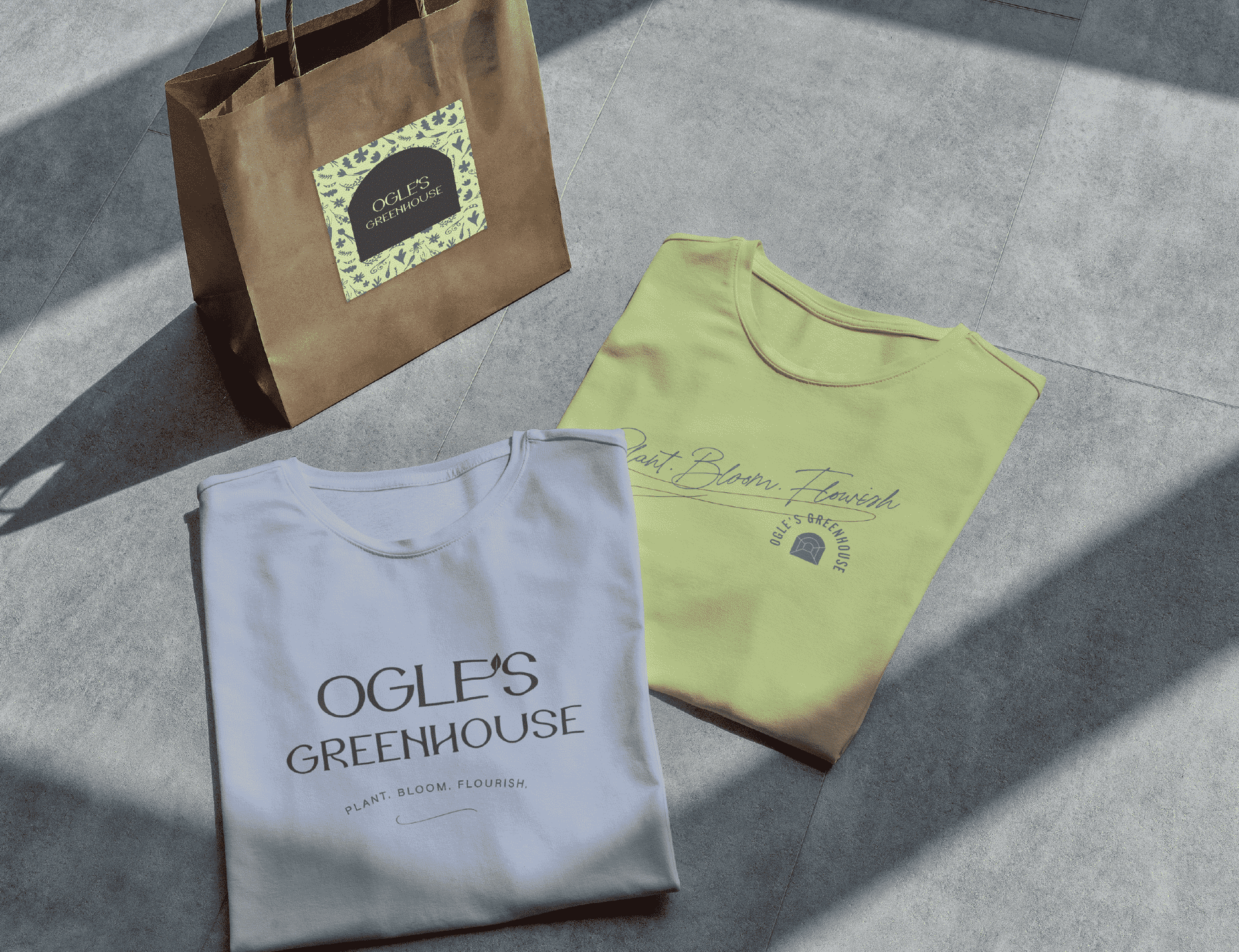 A t-shirt that says ogle 's greenhouse on it