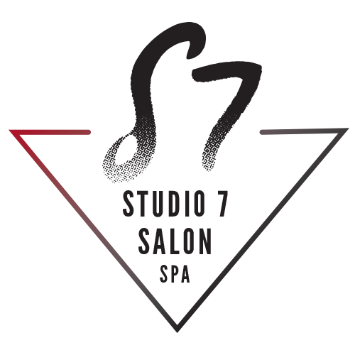 A logo for studio 7 salon spa in a triangle