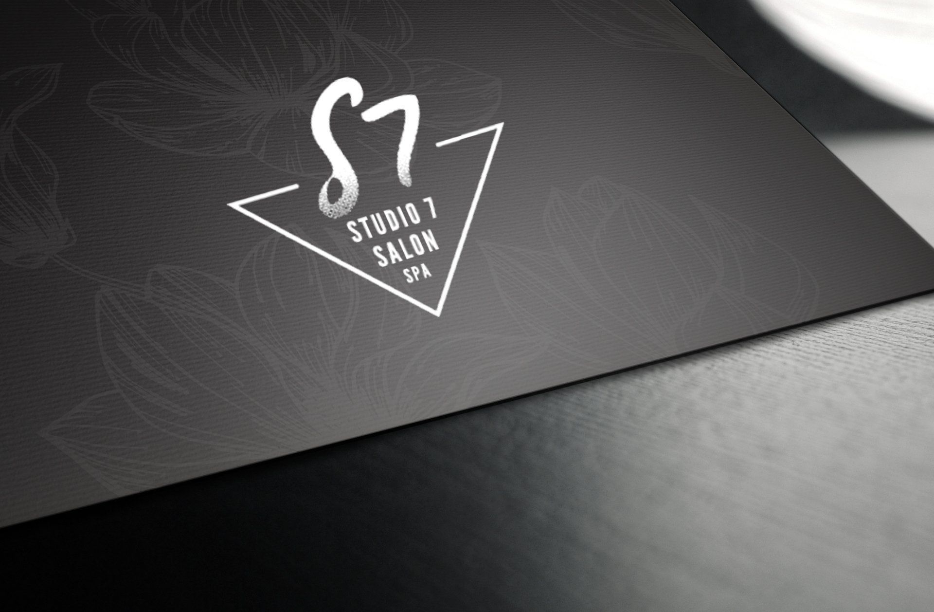 A black and white logo for s7 studio 7 salon spa