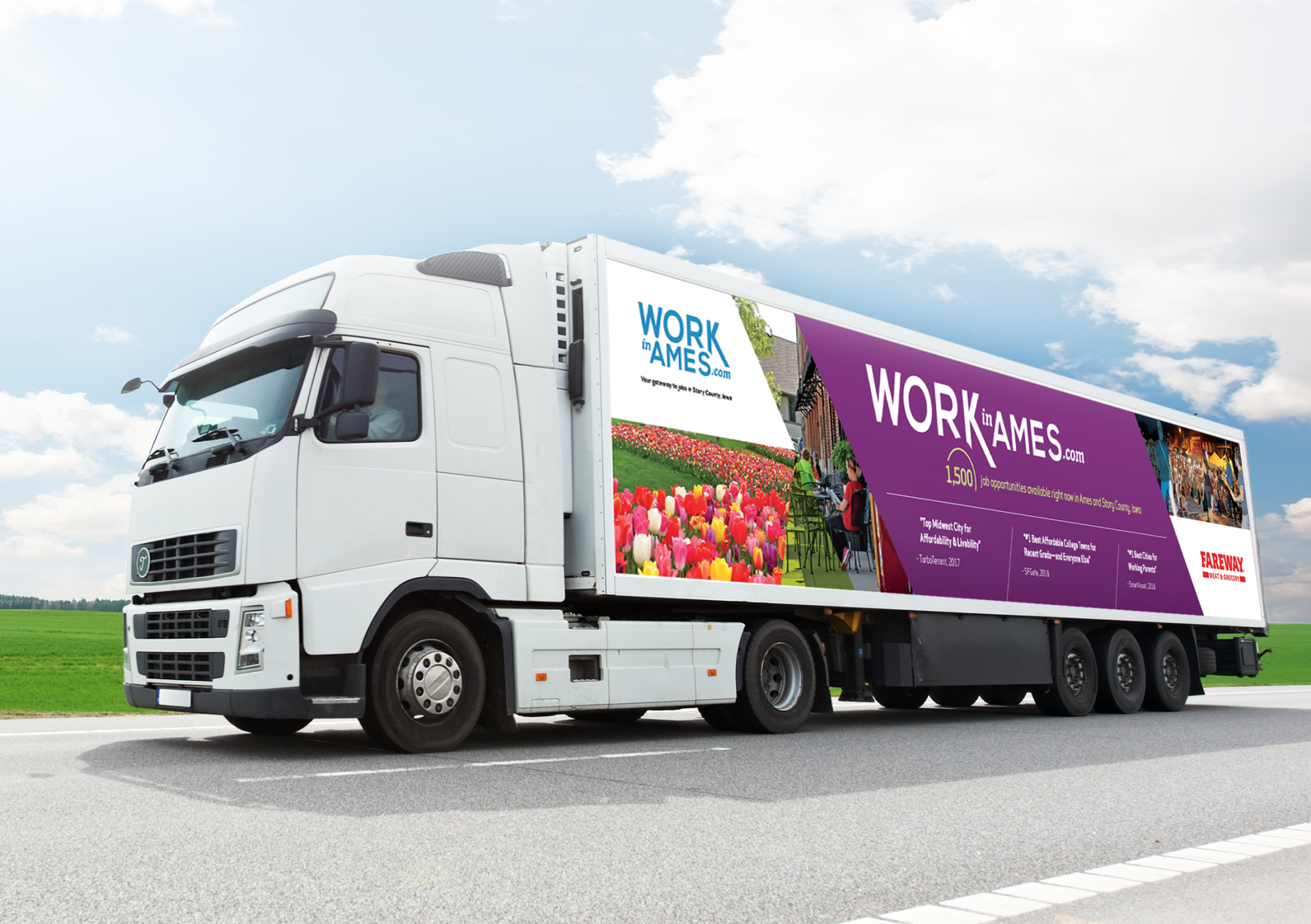 A white semi truck with a purple trailer is driving down a road.