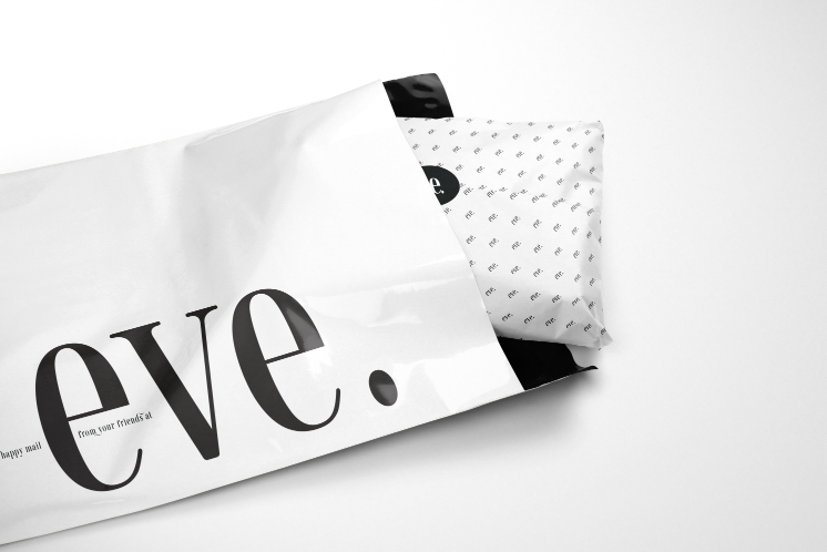 A white bag with the word eve on it