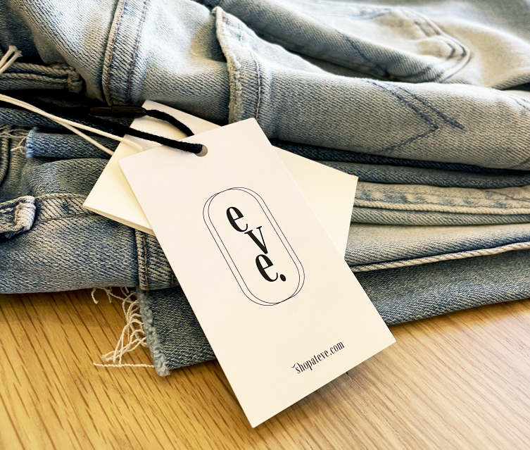 A pair of jeans with a tag attached to it
