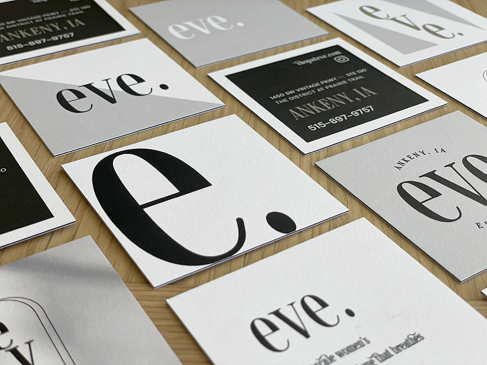 A bunch of business cards with the word eve on them