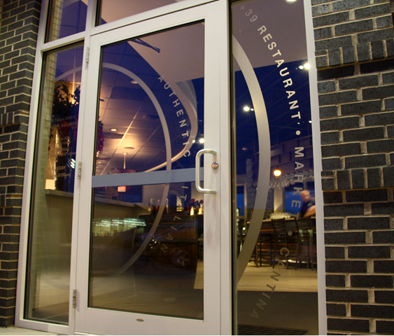 A glass door with the word restaurant on it