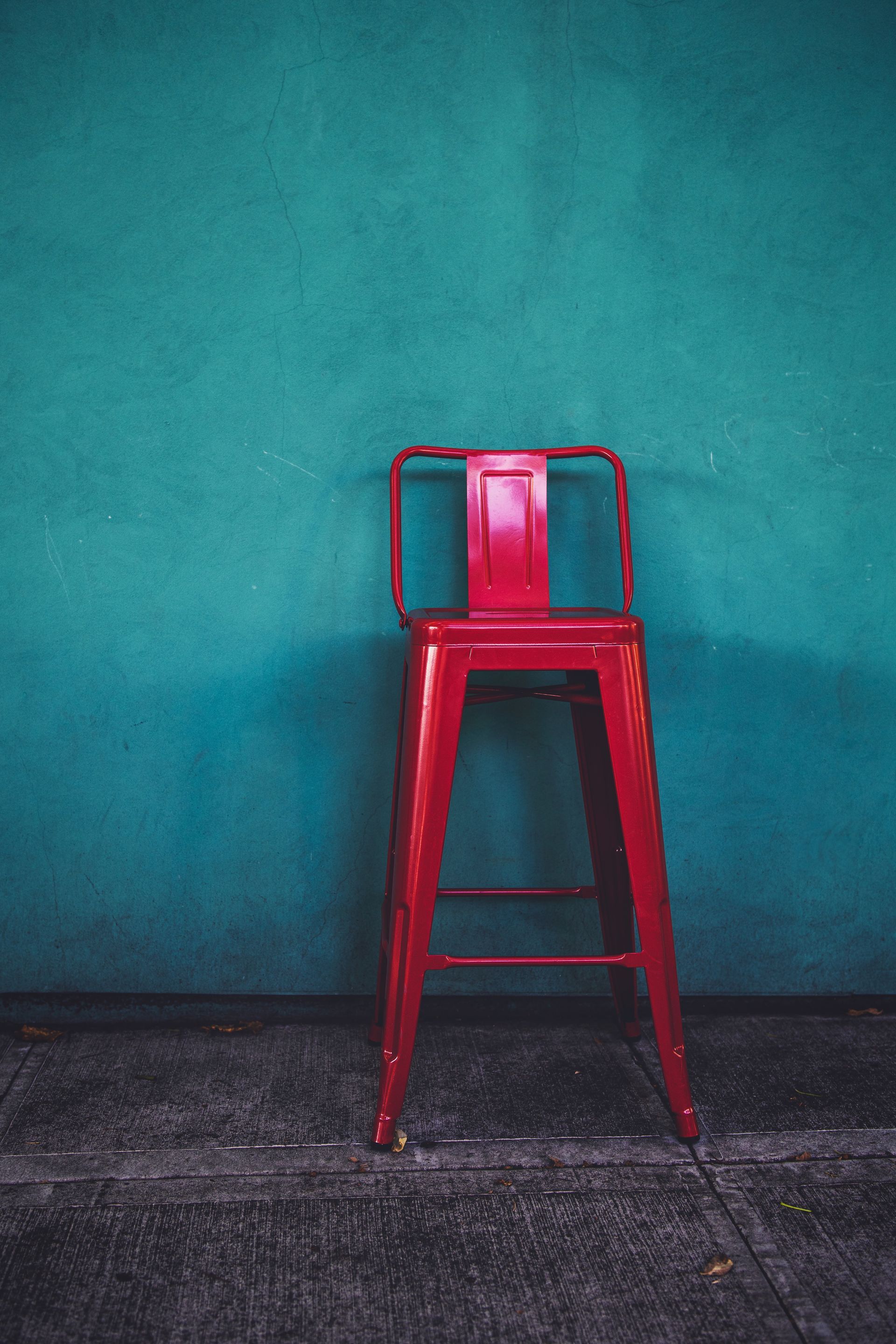 Pink Barstool against Teal Wall