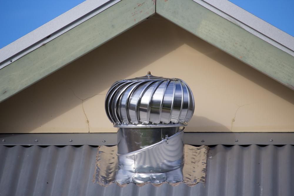 A Roof with A Stainless-Steel whirlybird — Bradley Roofing in Tuncurry, NSW