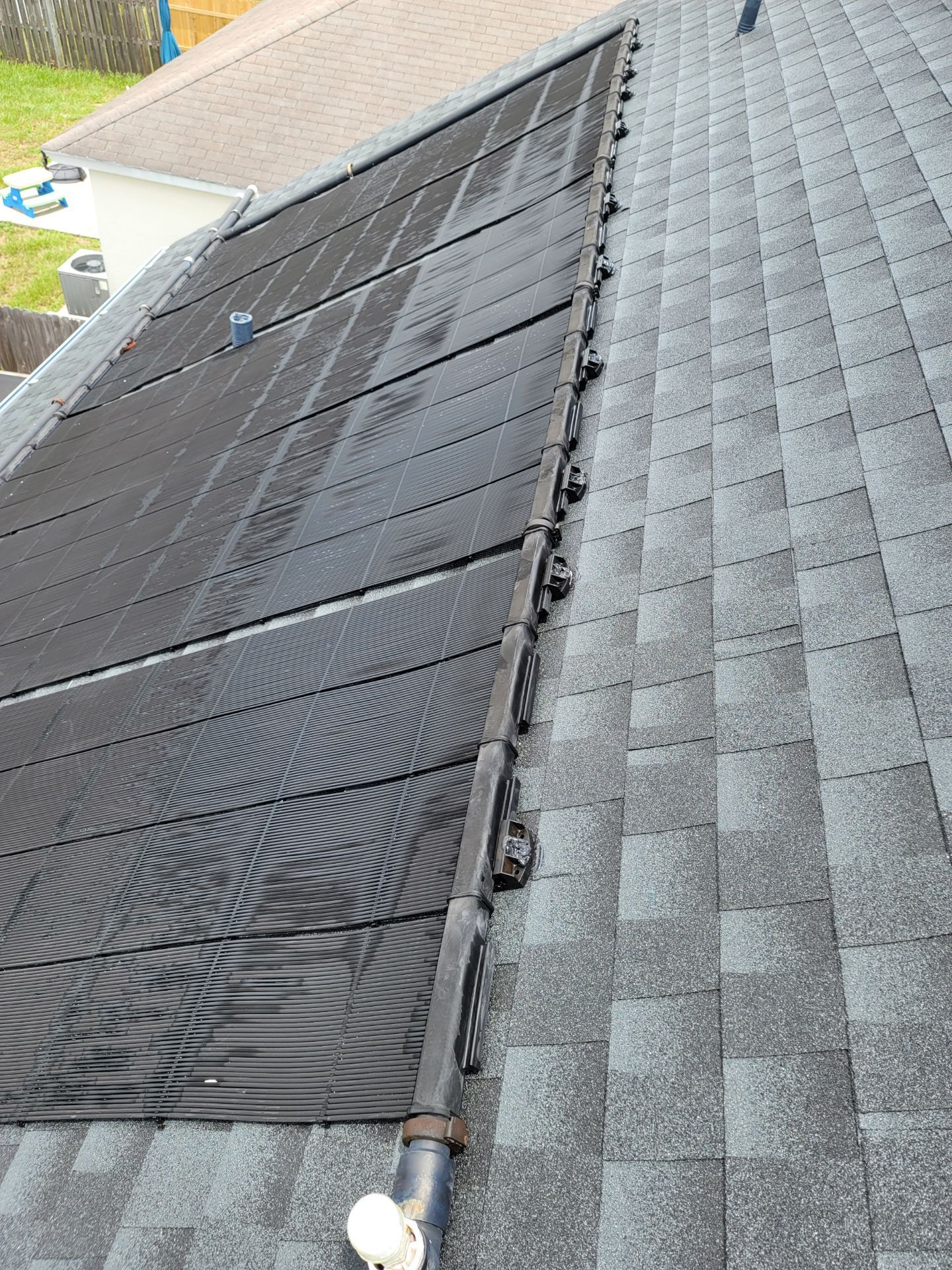 A roof with a solar panel installed on it
