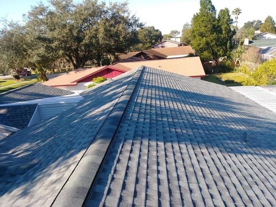 The roof of a house has a lot of shingles on it