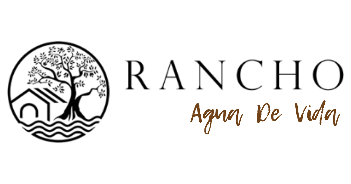 Logo for Rancho De Agua Vida, with a circular illustration of a tree, house, and water, with