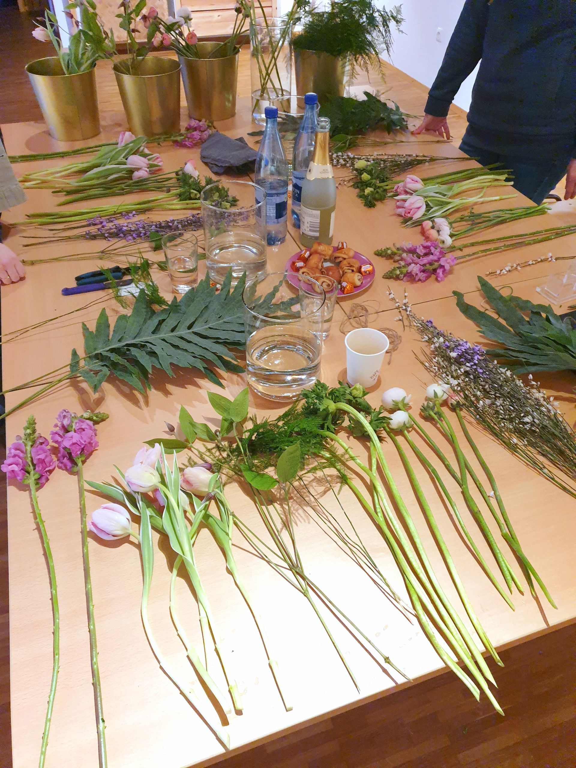A table with flowers and leaves on it