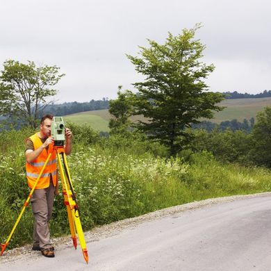 Man on the Road using Theodolite — Snyder, Ok — North Fork Surveying & Drafting