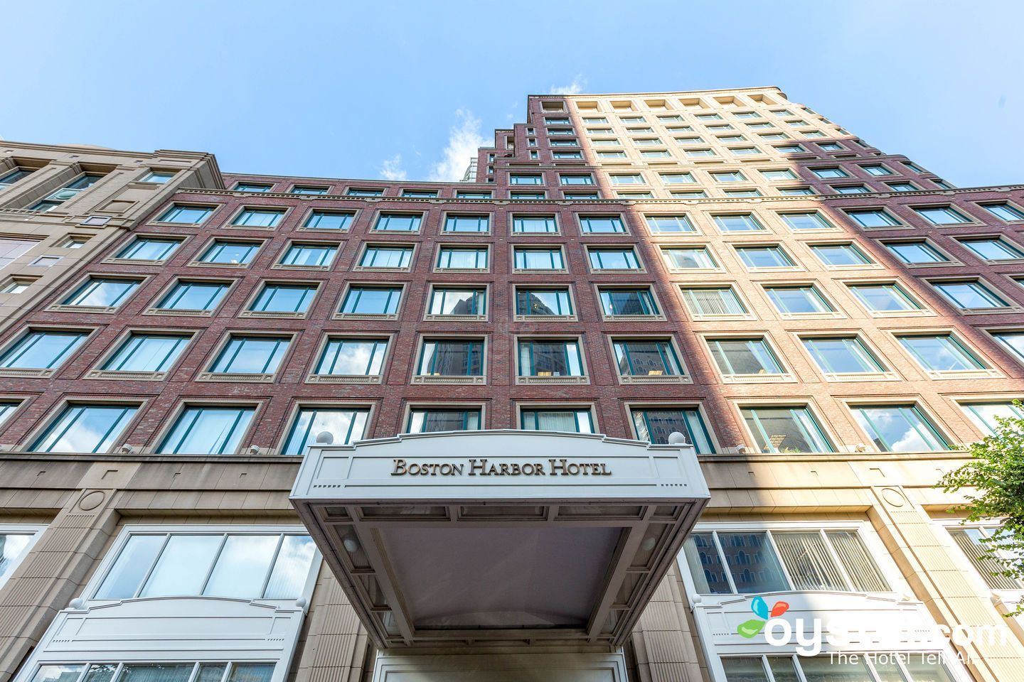 A large building with a lot of windows and a sign that says ' brooklyn harbor hotel ' on it.