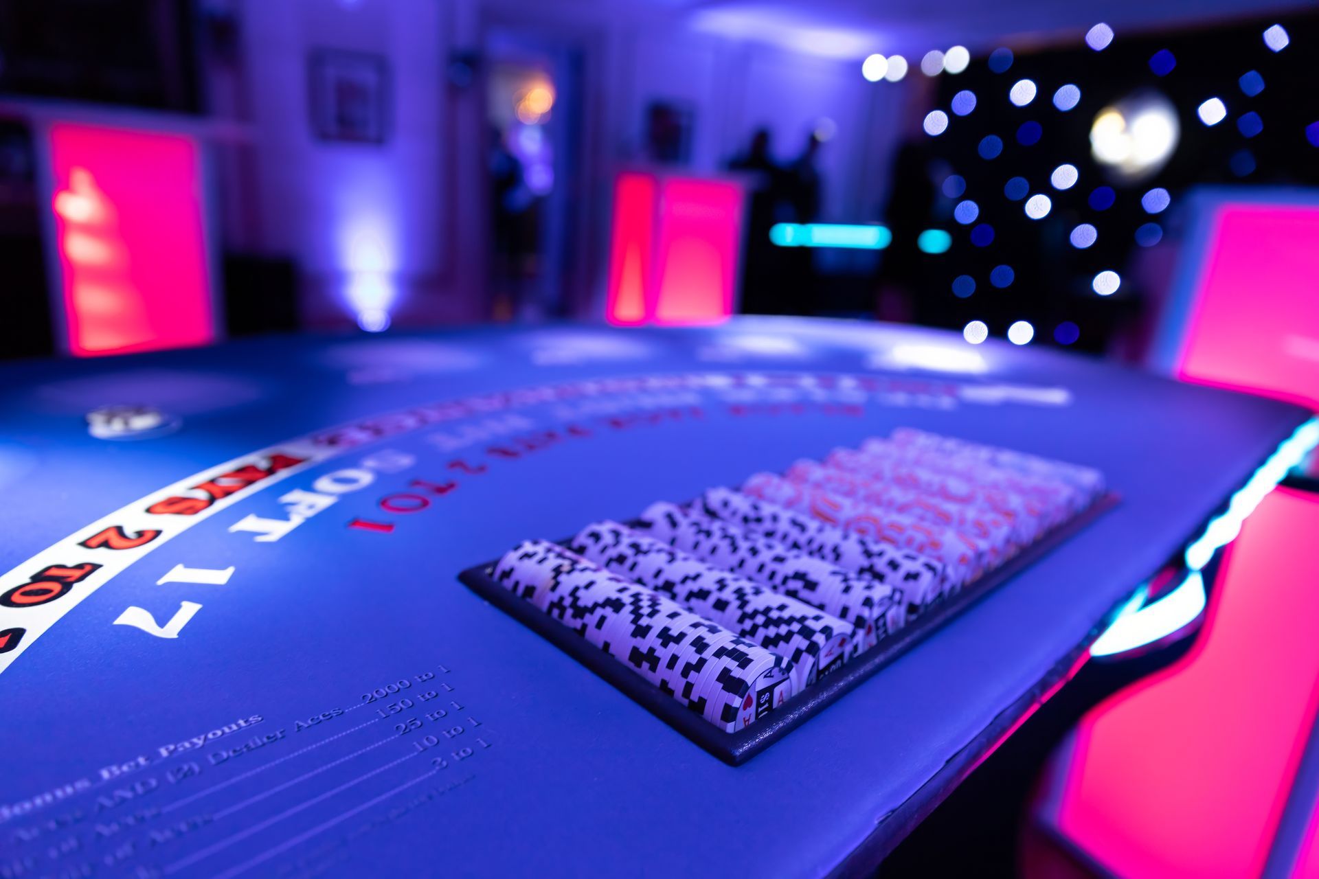 A close up of a blackjack table in a dark room.