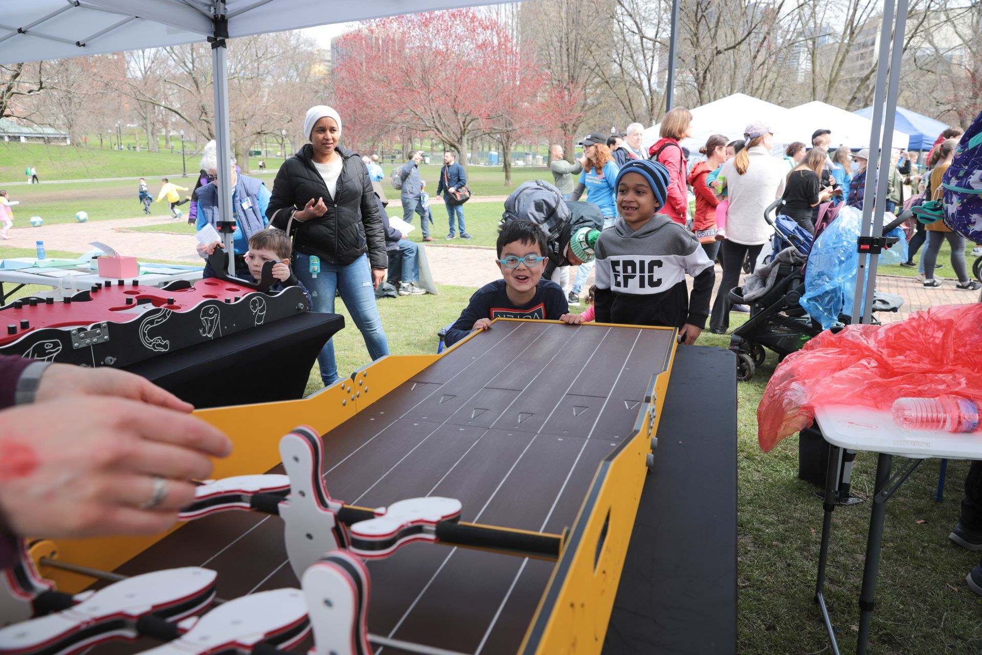 A group of children are playing a game in a park.