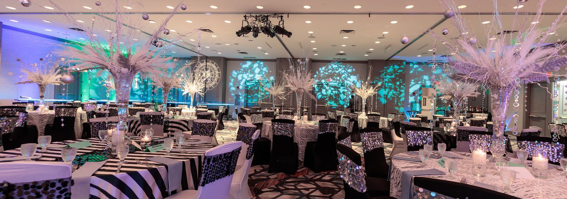 A bride and groom are dancing their first dance at a wedding reception.