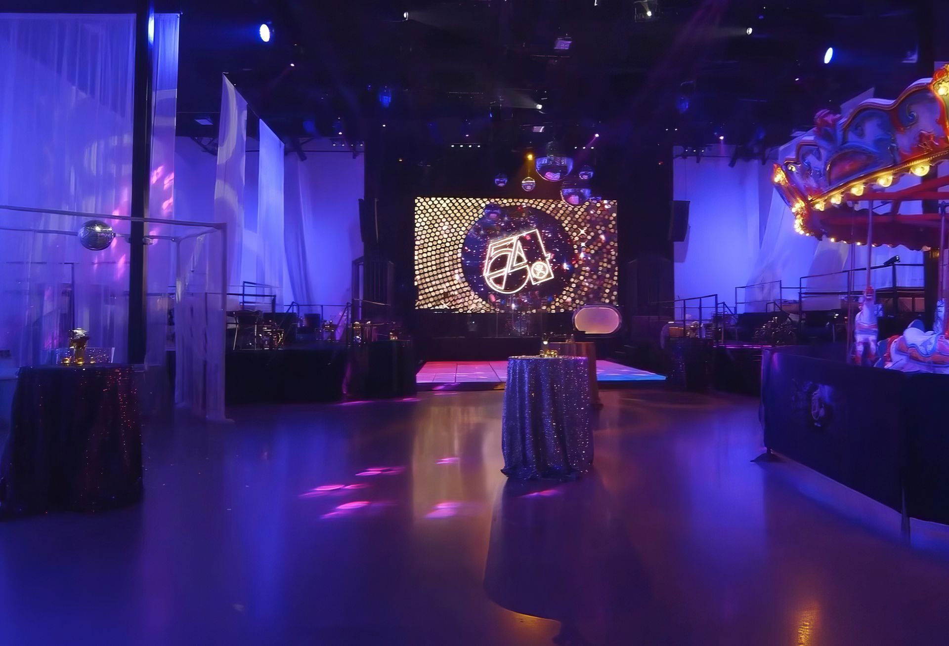 Studio 54 Custom Logo on a large LED Screen with Dance Floor and Purple Lighting