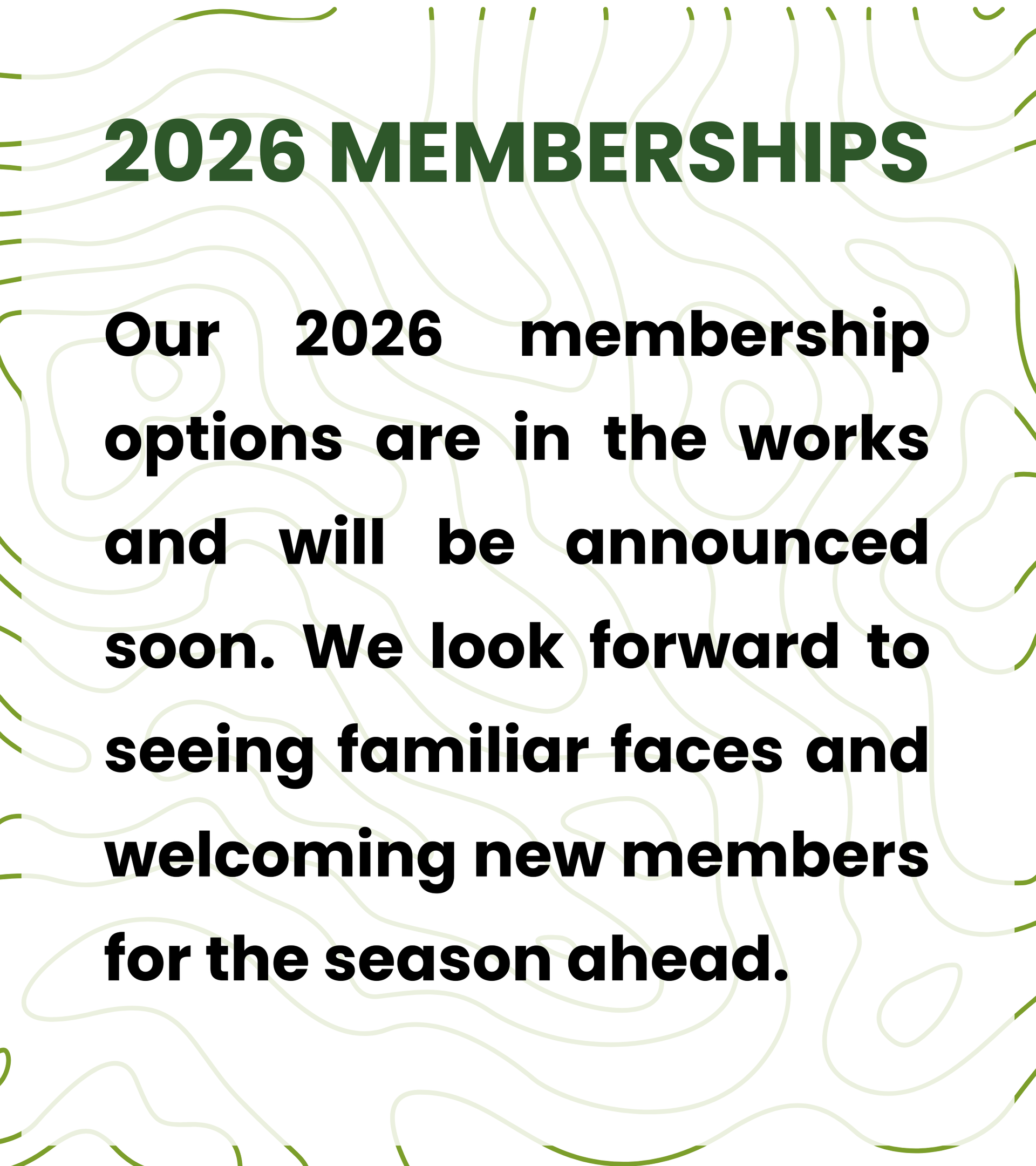 A foggy golf course with trees in the background