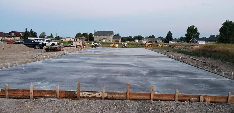A large concrete slab is being built on a construction site.